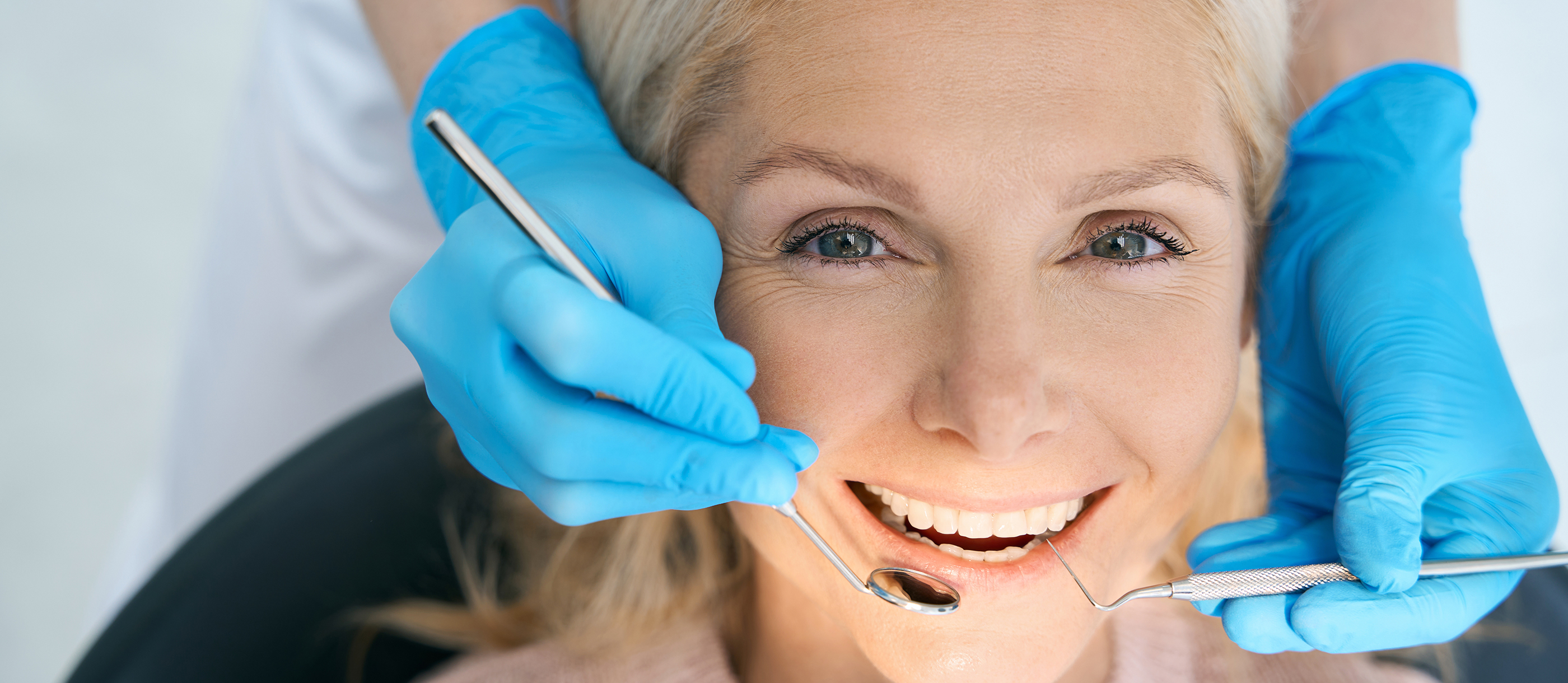 Woman receiving a dental checkup and cleaning in Stuart